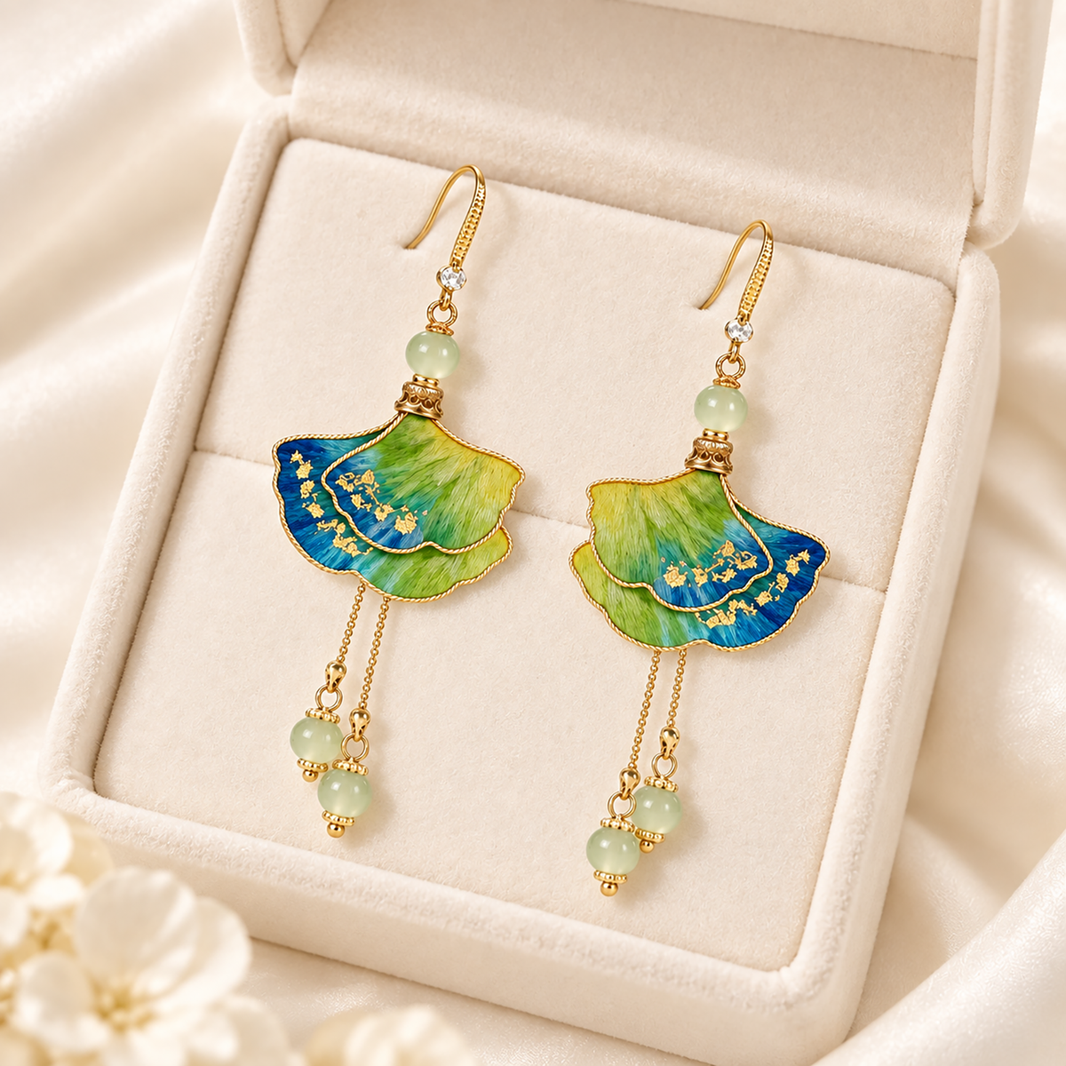 Jiangshan Ginkgo blue-green-yellow mulberry-silk Ronghua drop earrings on a stand