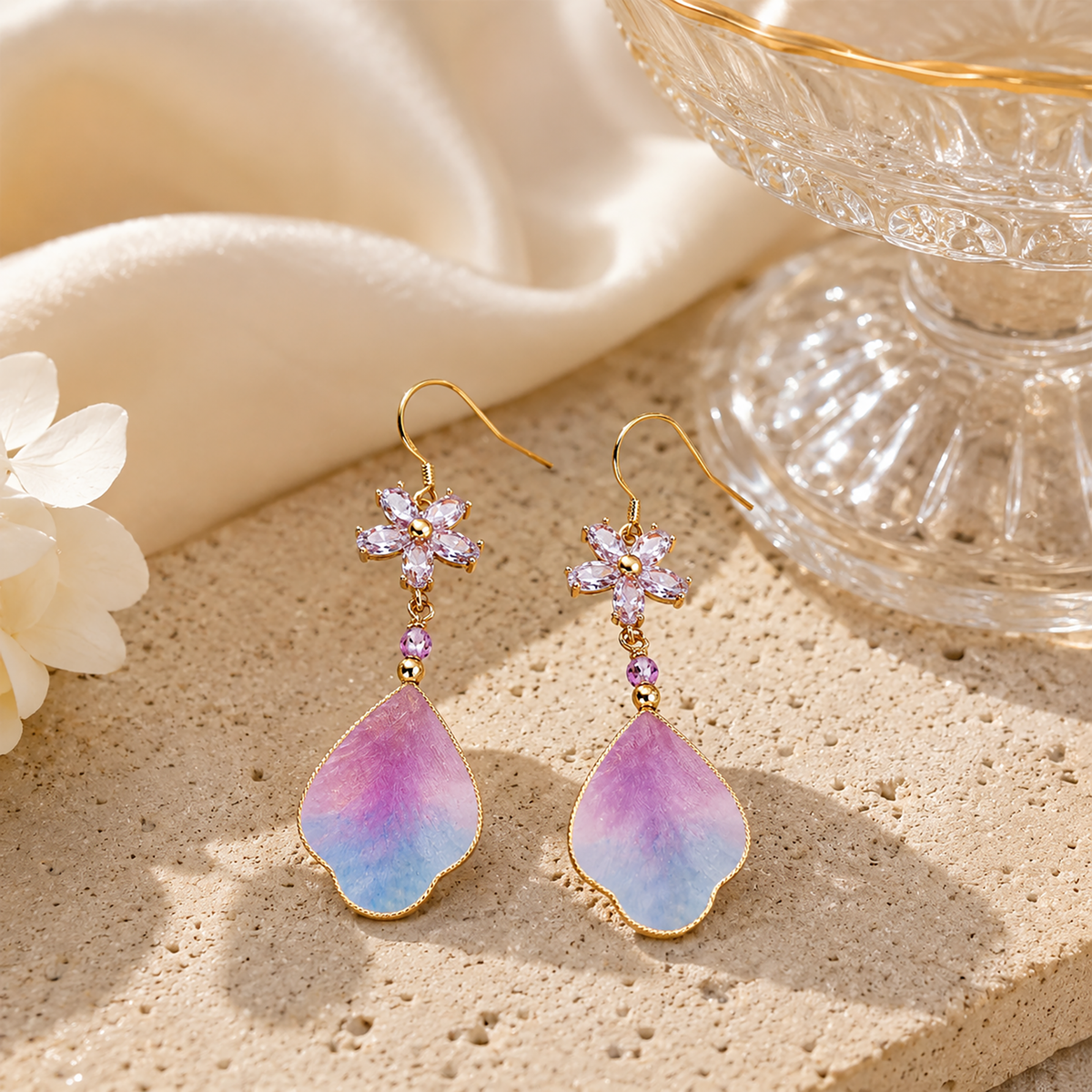 Purple cloud silk velvet earrings displayed on ivory silk