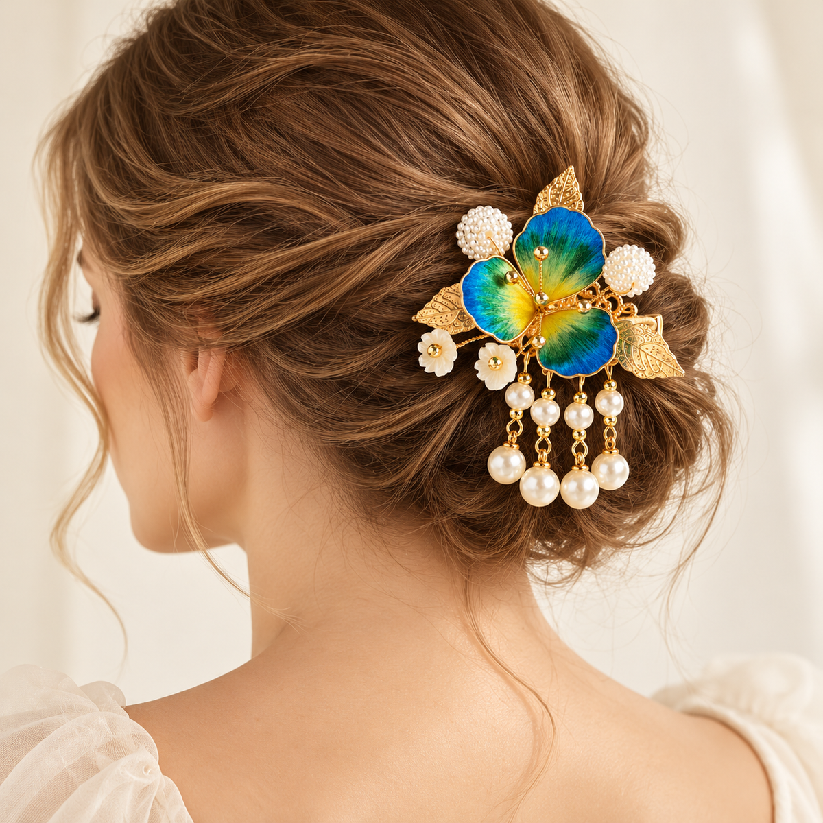 Blue-green blossom tassel hair clip worn in a bun