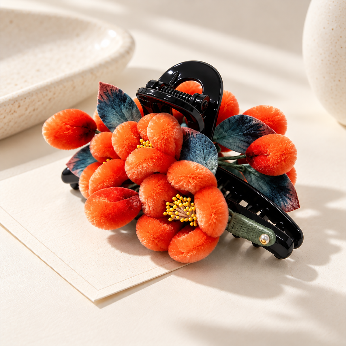 Orange persimmon mulberry-silk Ronghua claw hair clip on cream surface