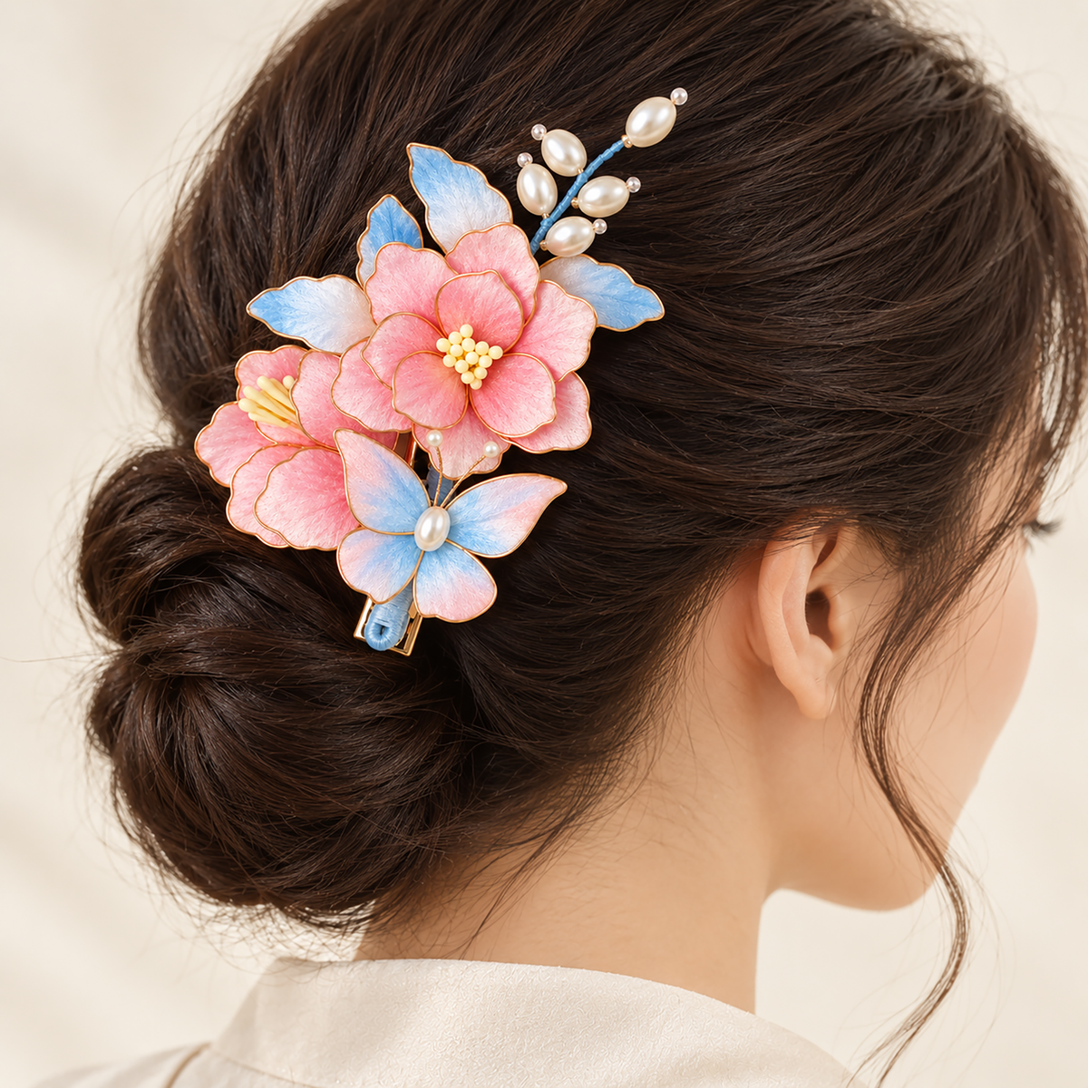 Pink peach blossom Ronghua hair clip worn in a low bun