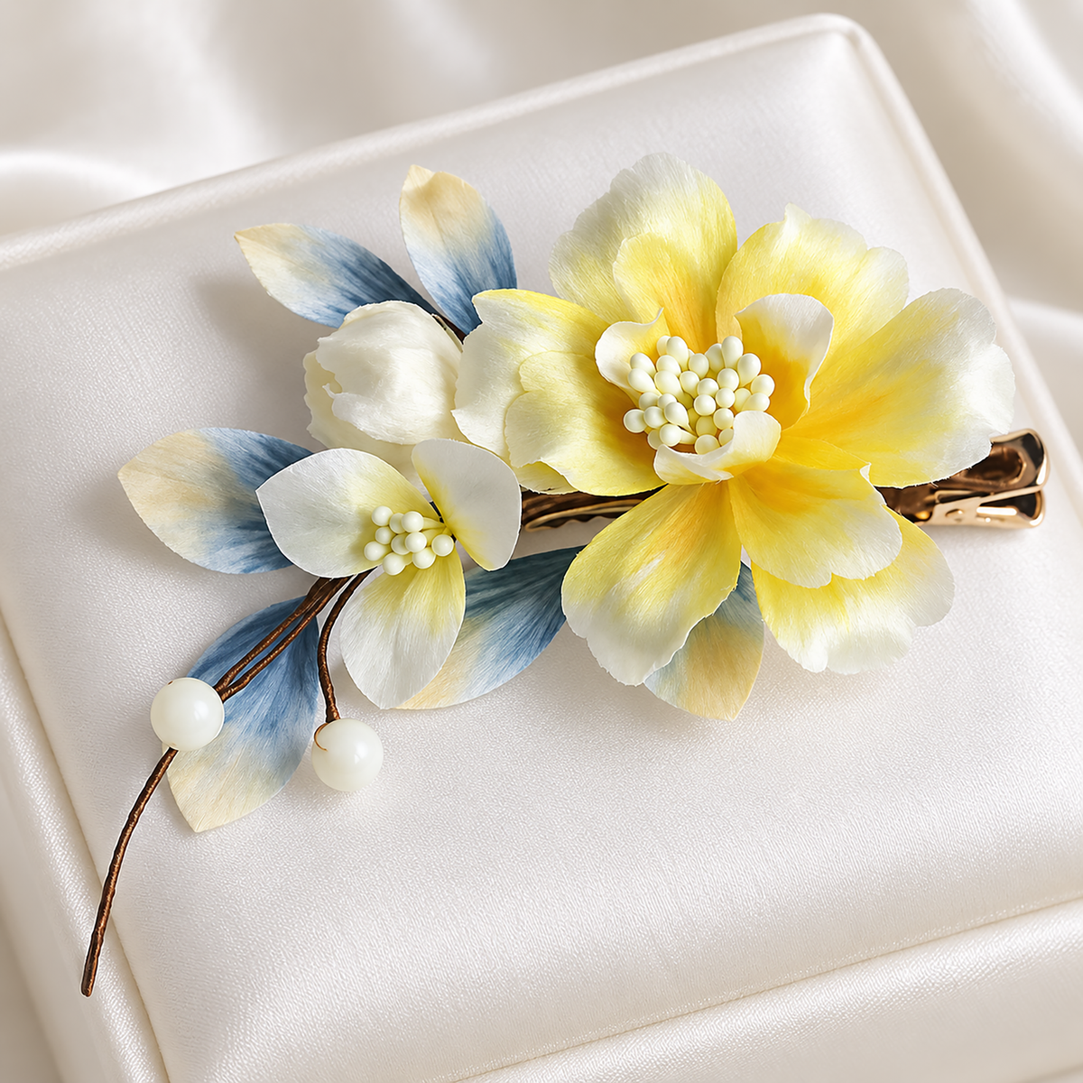 Yellow blossom Ronghua hair clip on an ivory satin cushion