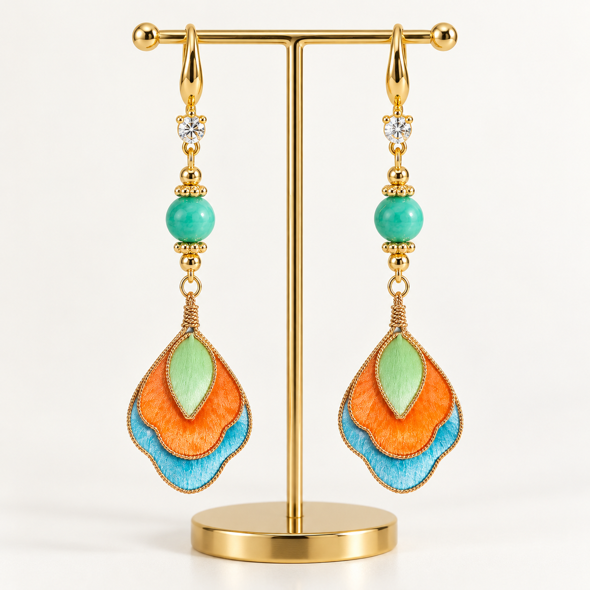 Feitian Dunhuang Ronghua drop earrings on a display stand
