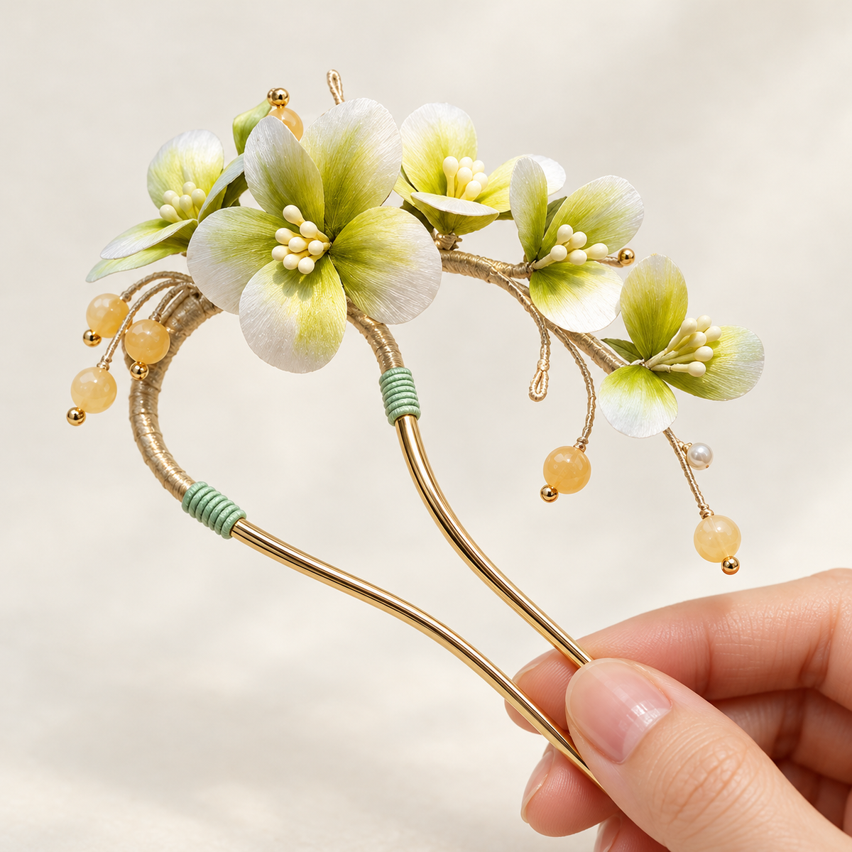 Green-white Ronghua hair stick held in hand