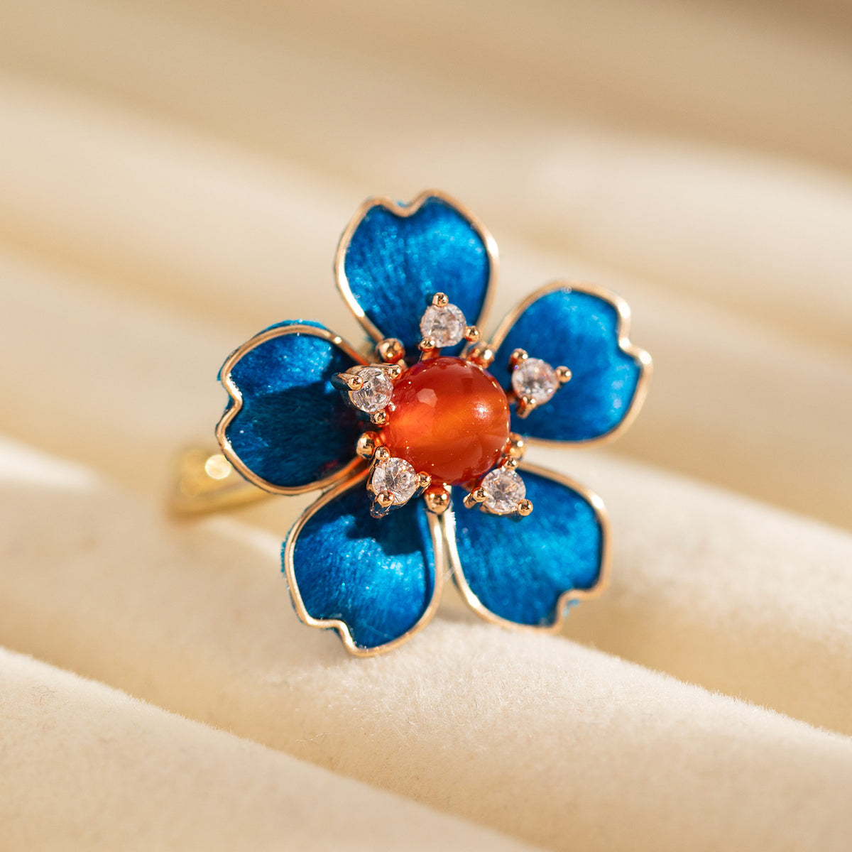Close-up of blue silk-fibre flower ring with clear decorative stones