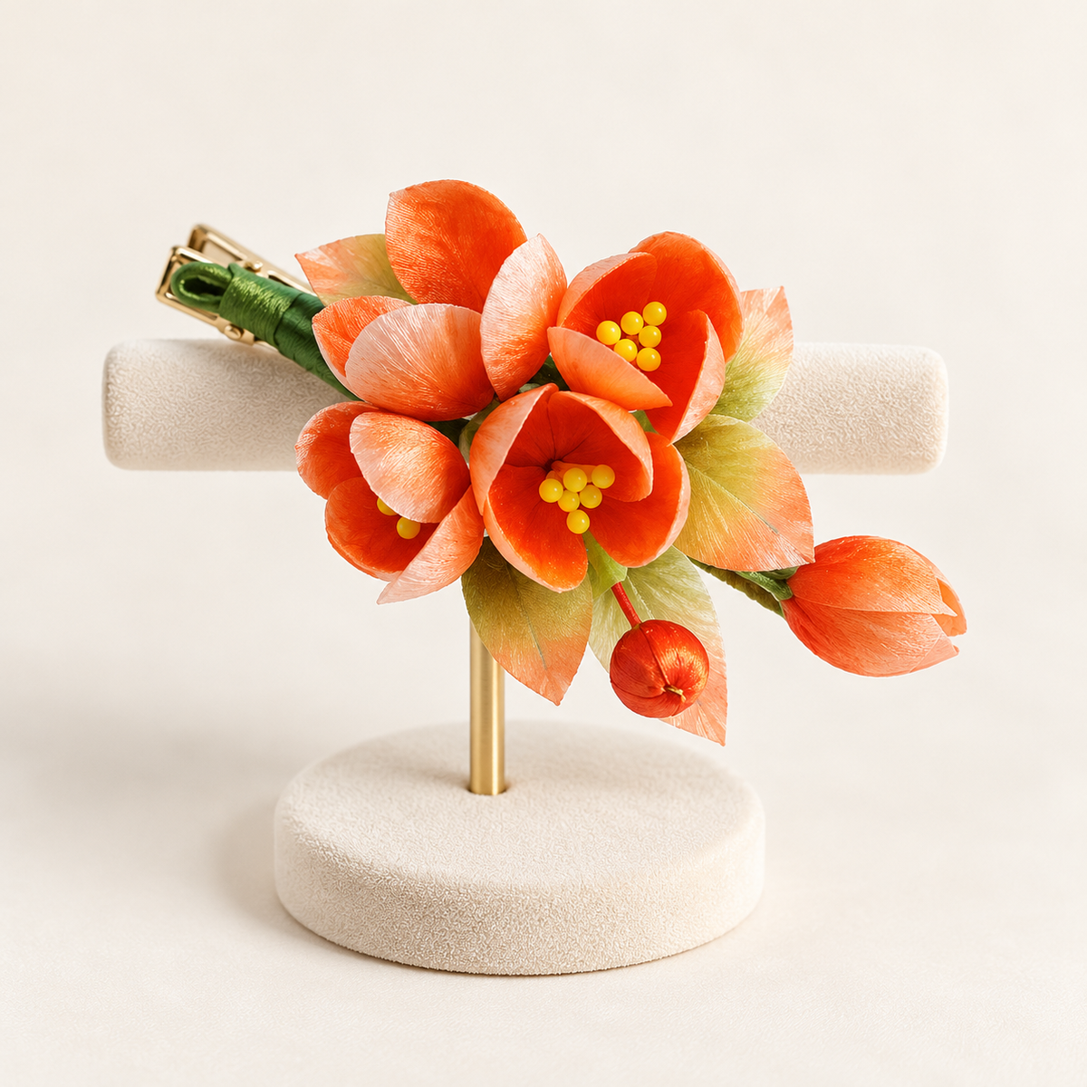 Orange blossom hair clip on a display stand