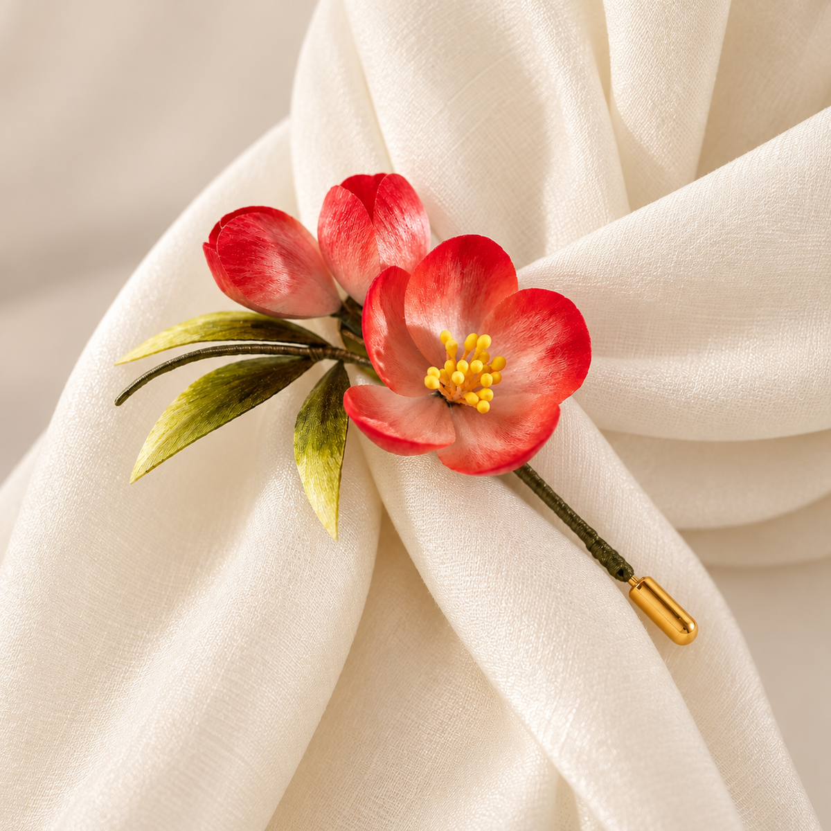 Red plum blossom Ronghua brooch on draped fabric