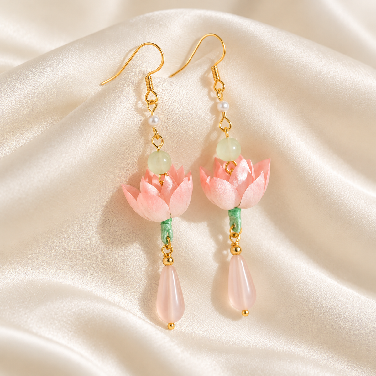 Qinghe lotus silk Ronghua earrings on draped satin