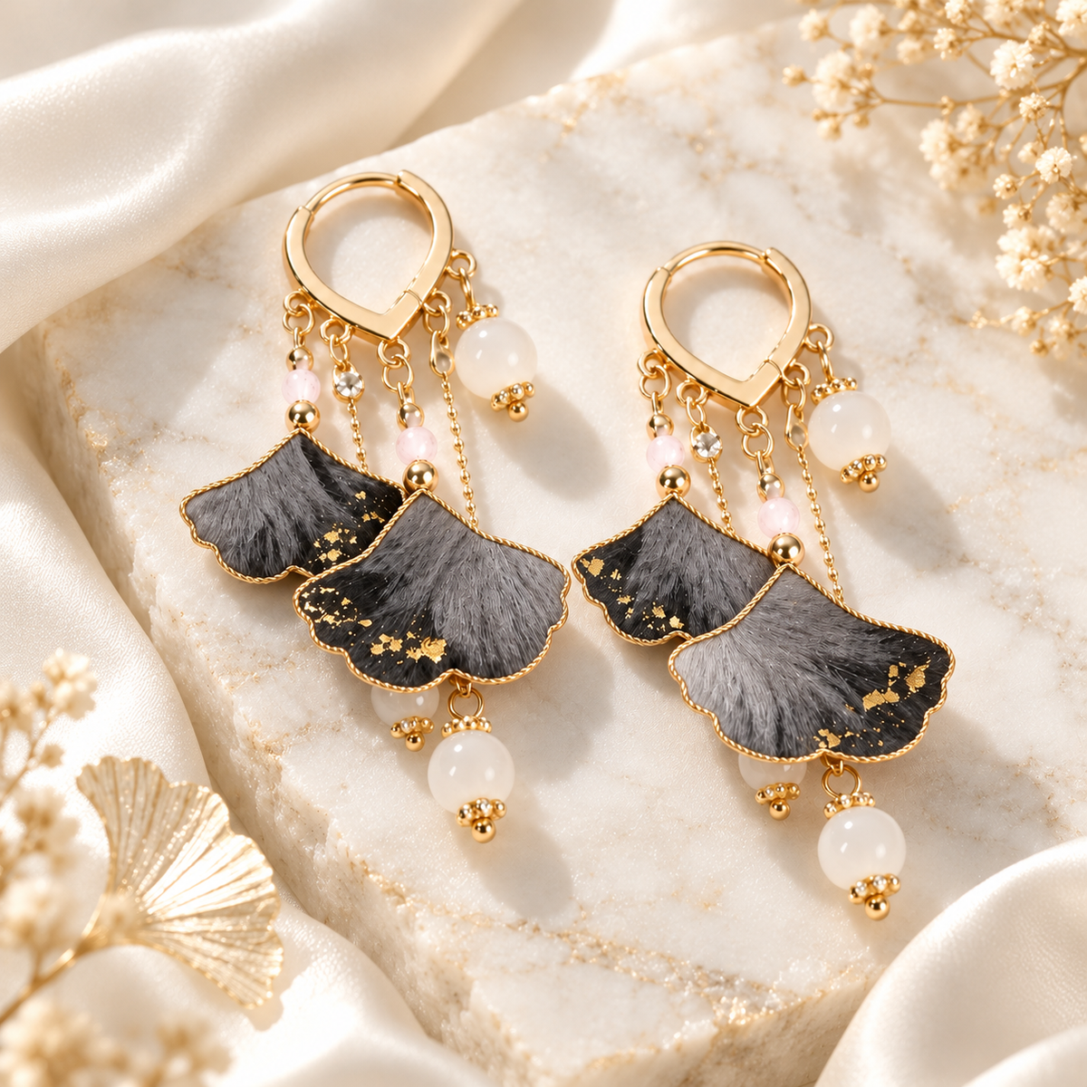 Twin ink ginkgo silk Ronghua earrings on marble