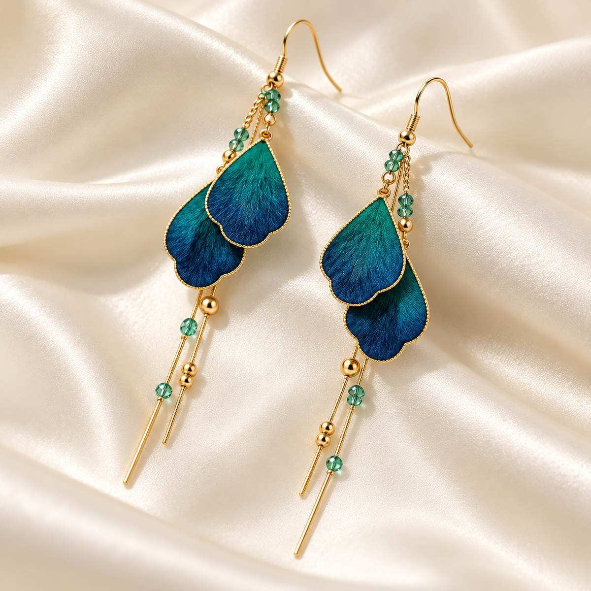 Teal-blue silk Ronghua drop earrings with chain tassels on cream silk
