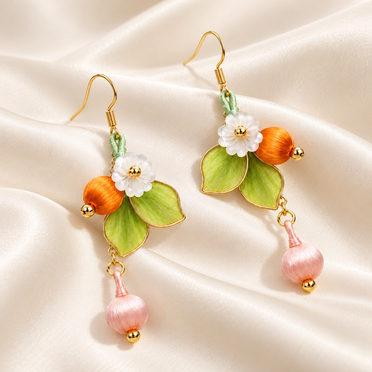 Forest blossom silk Ronghua earrings on draped satin