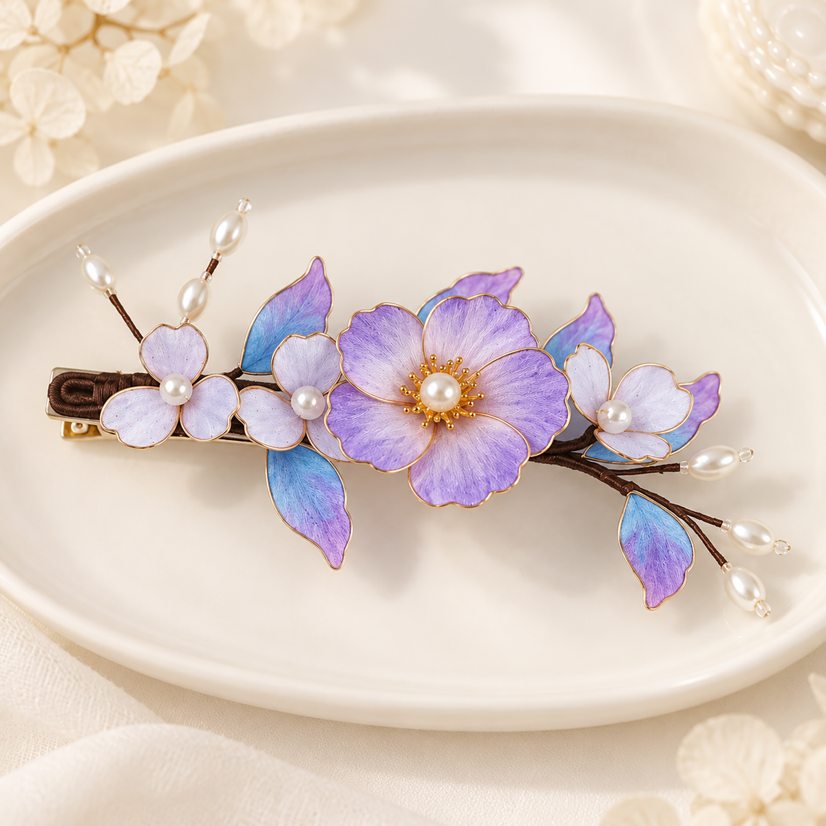Purple blossom hair clip on an ivory dish showing the metal alligator clip