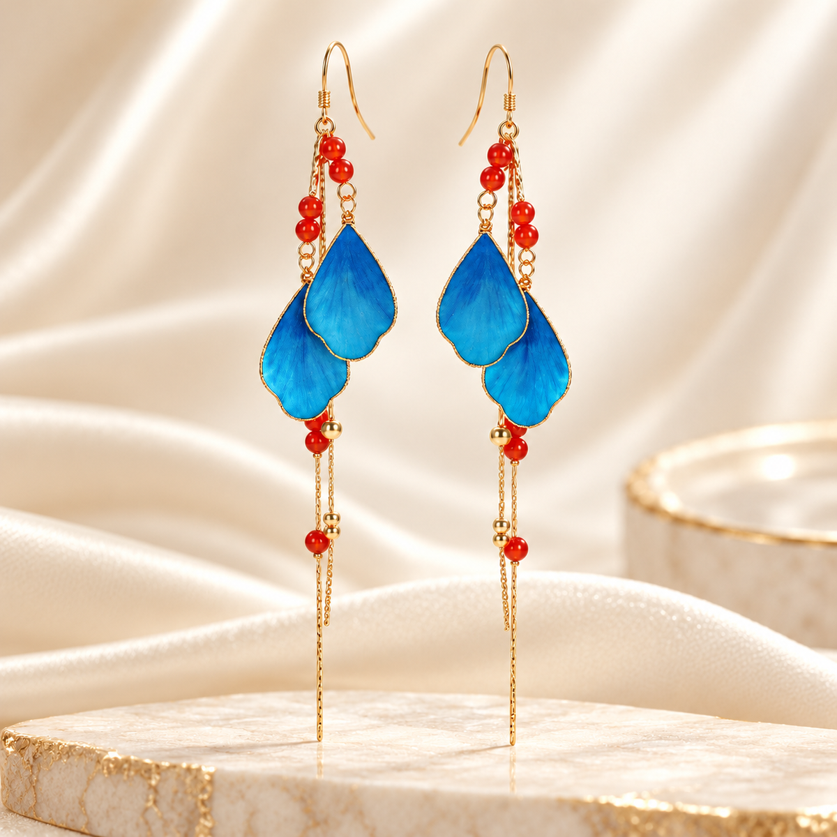Blue petal silk Ronghua tassel earrings on marble
