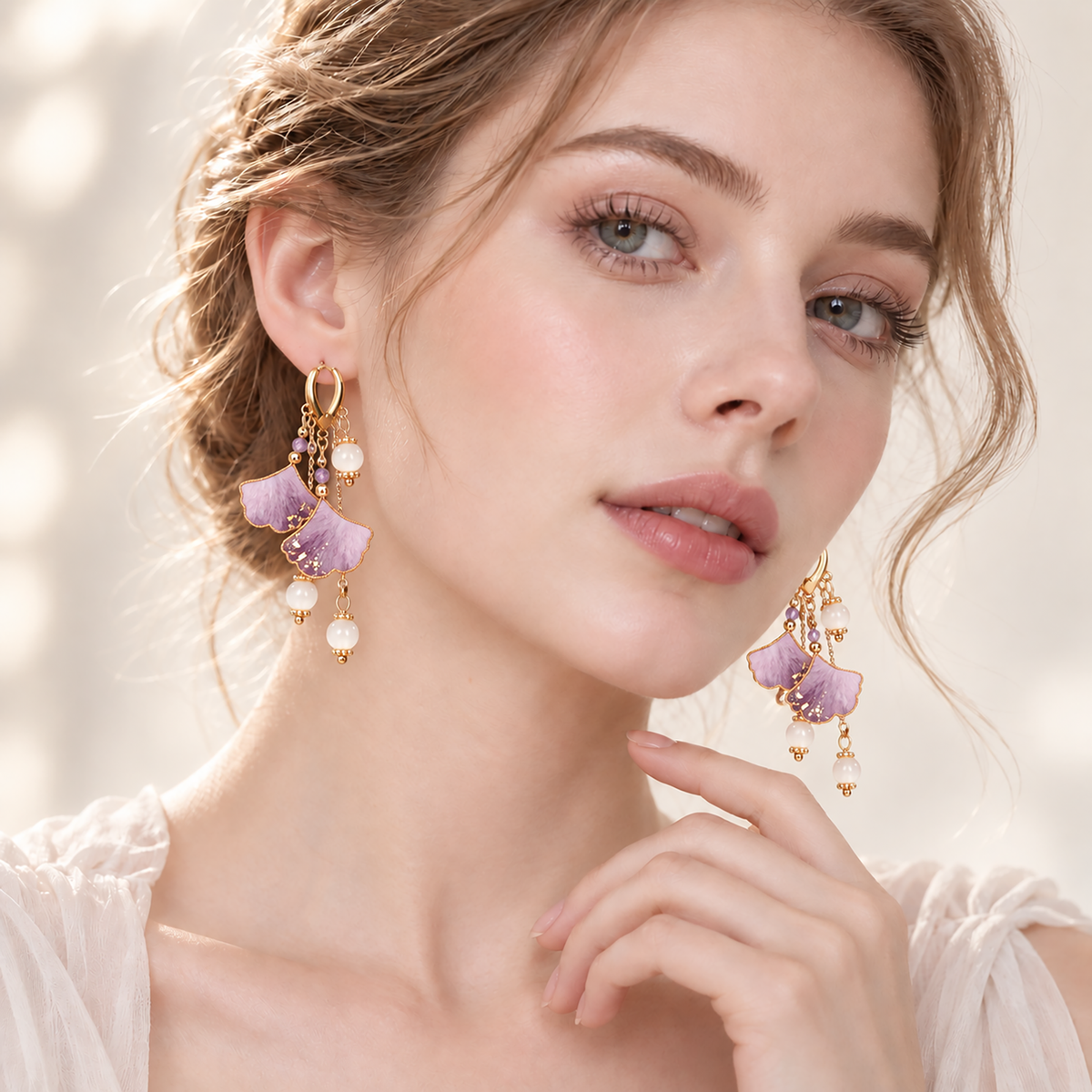 Woman wearing the twin purple ginkgo silk Ronghua drop earrings