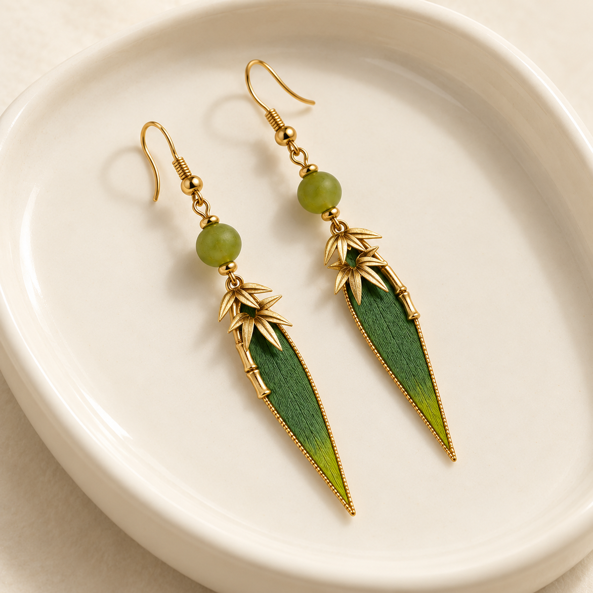 Zhuyun Qinghuan earrings on a ceramic dish