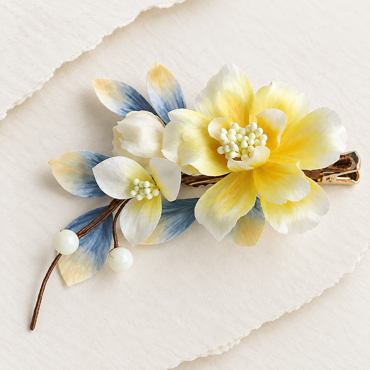 Yellow and white Ronghua blossom with blue-tipped leaves and pearl-look drops