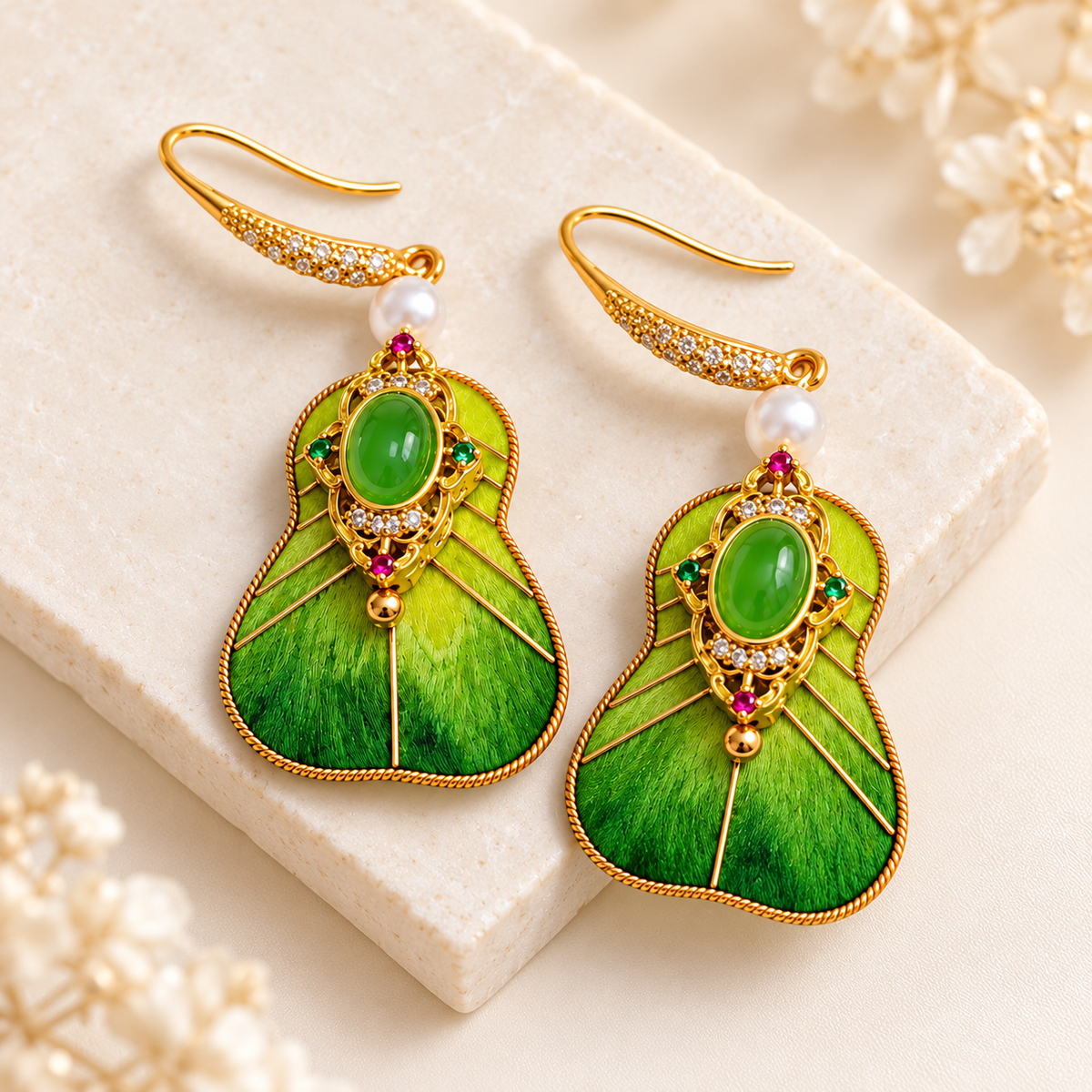 Green fan Ronghua earrings on a stone tray