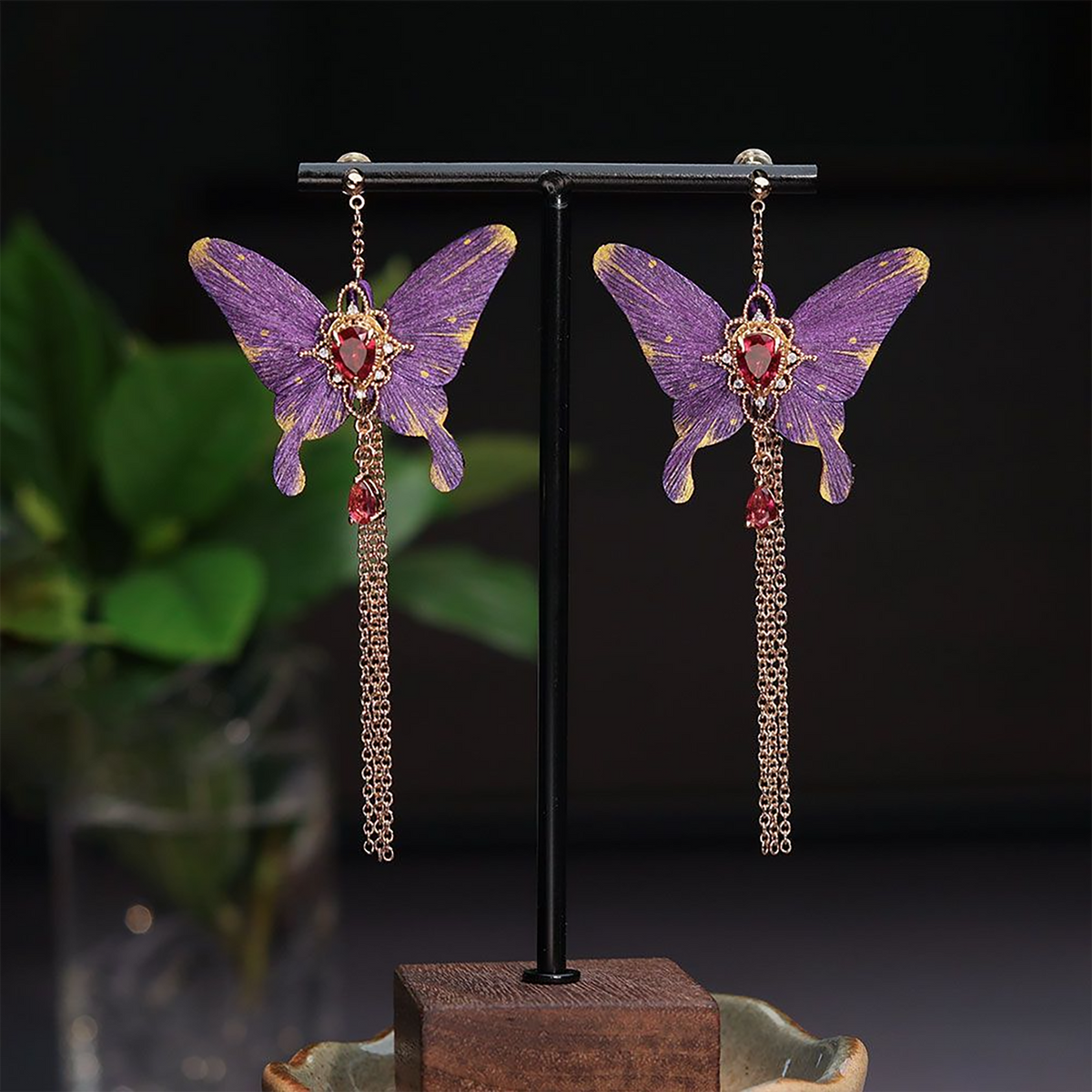 Purple butterfly silk velvet tassel earrings displayed as a pair