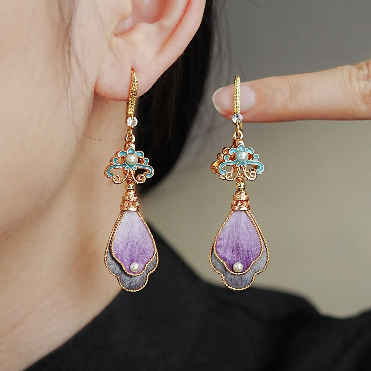 Model wearing Twilight Cloud Mountain lavender silk velvet drop earrings