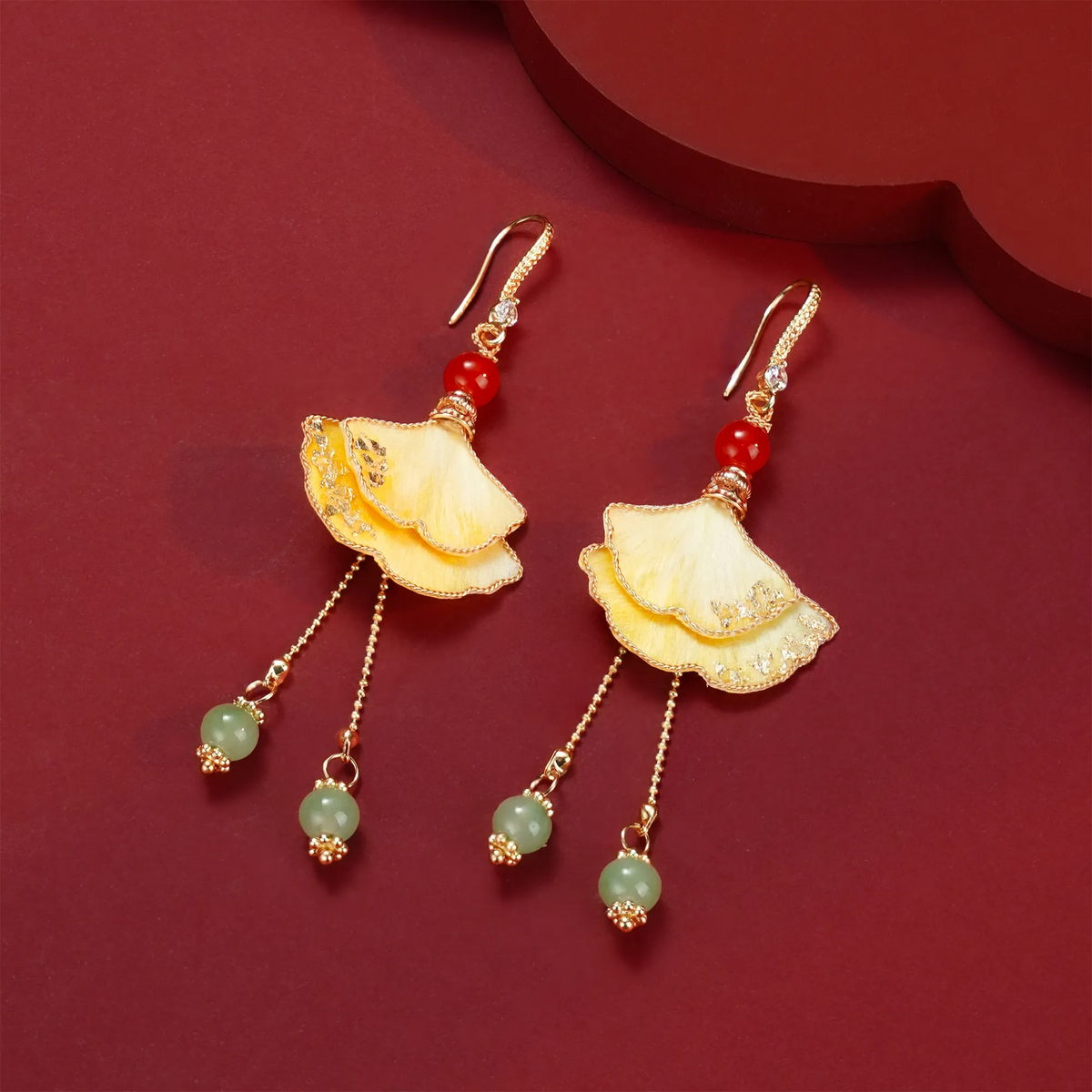 Golden Yellow Ginkgo Ronghua earrings with layered leaves and bead tassels