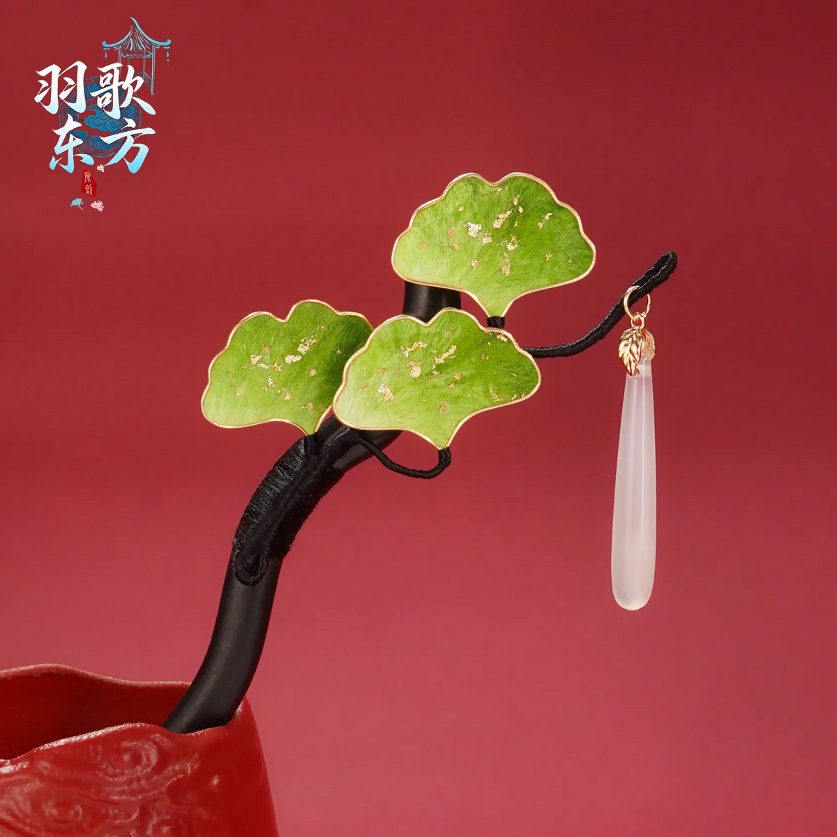 Green Ginkgo Ronghua Hairpin on a red background