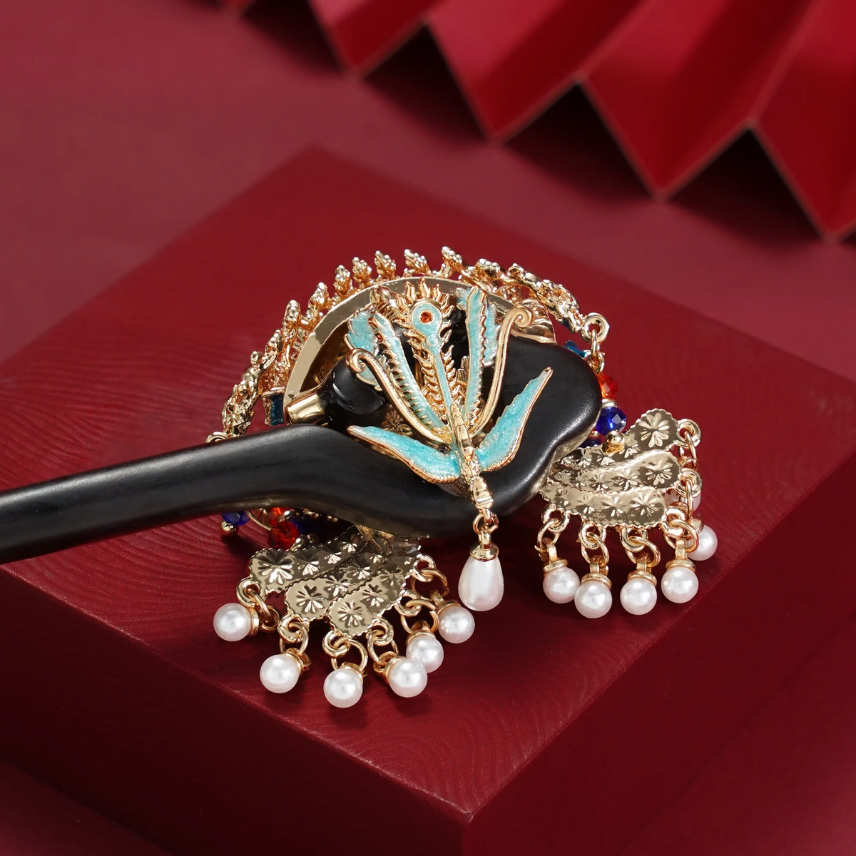 Nine Dragons Nine Phoenixes Crown Hairpin on a styled background
