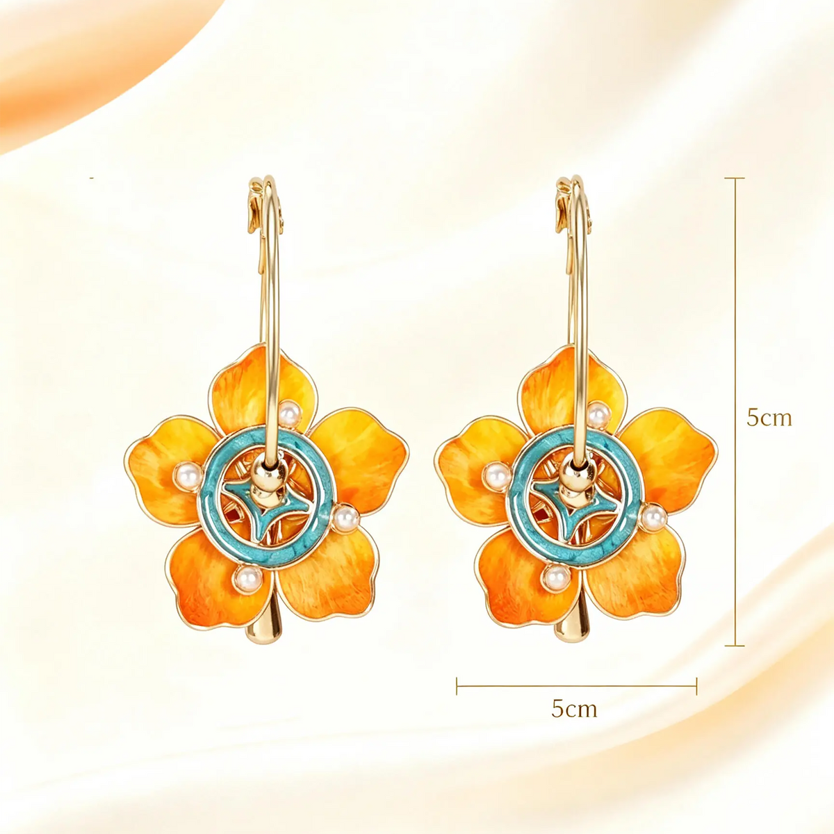 Orange silk flowers with teal circular centres on gold-tone hoops supplier size guide labelled 5 by 5 cm