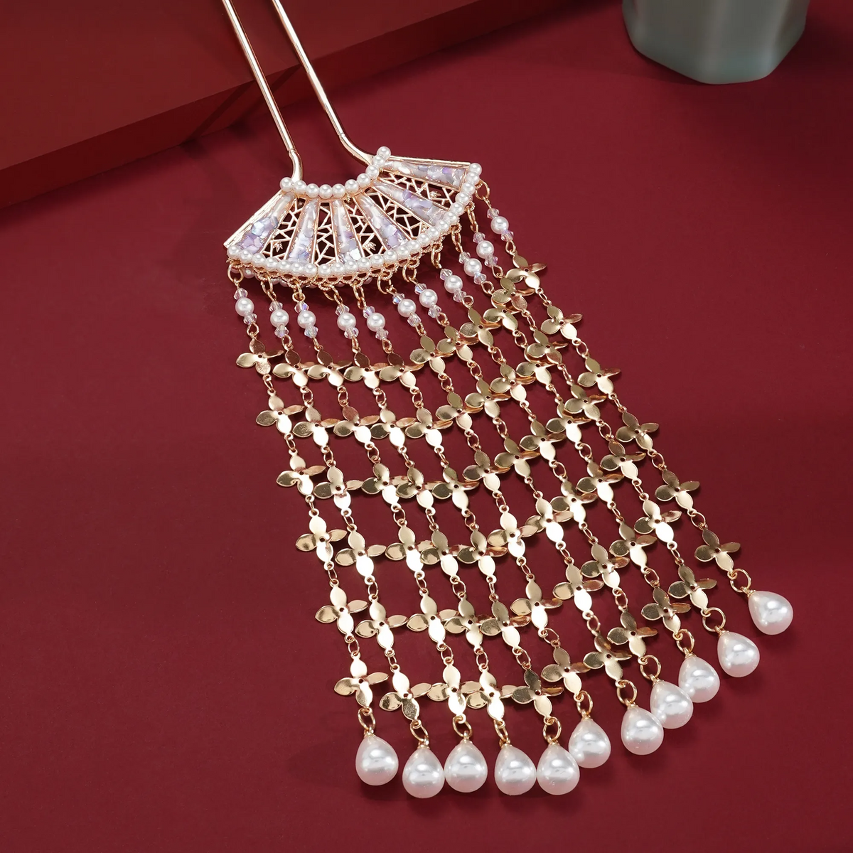 Yaoguang Fan Tassel Hairpin on a styled background