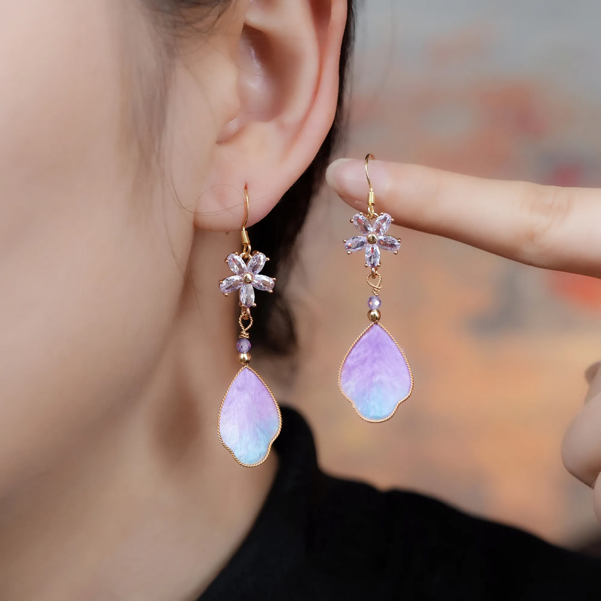 Purple cloud silk velvet drop earrings worn by a model
