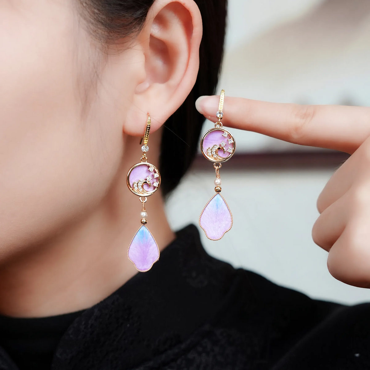 Purple rosy cloud silk velvet drop earrings worn by a model