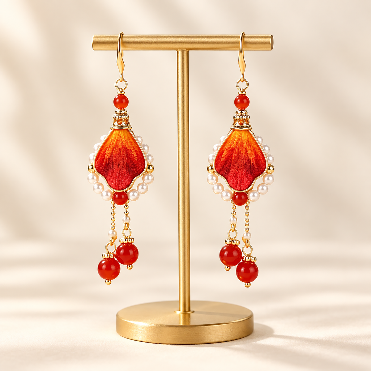 Woman wearing Phoenix Path orange-crimson silk Ronghua drop earrings
