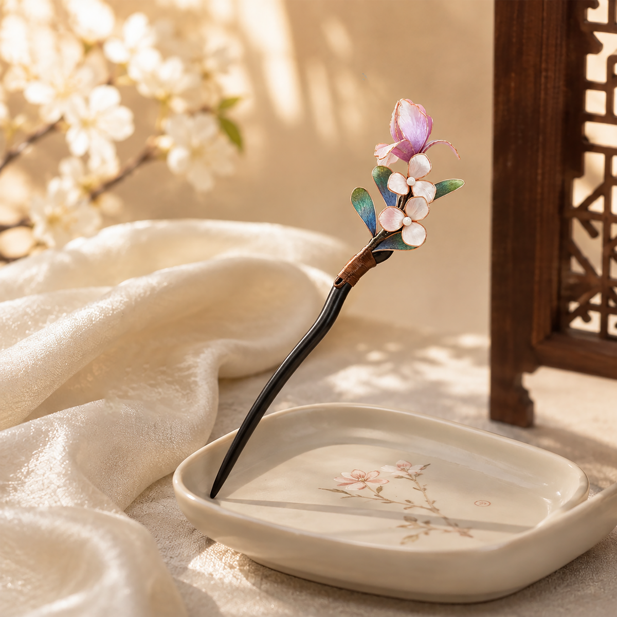 Pink butterfly blossom hairpin displayed on ivory silk