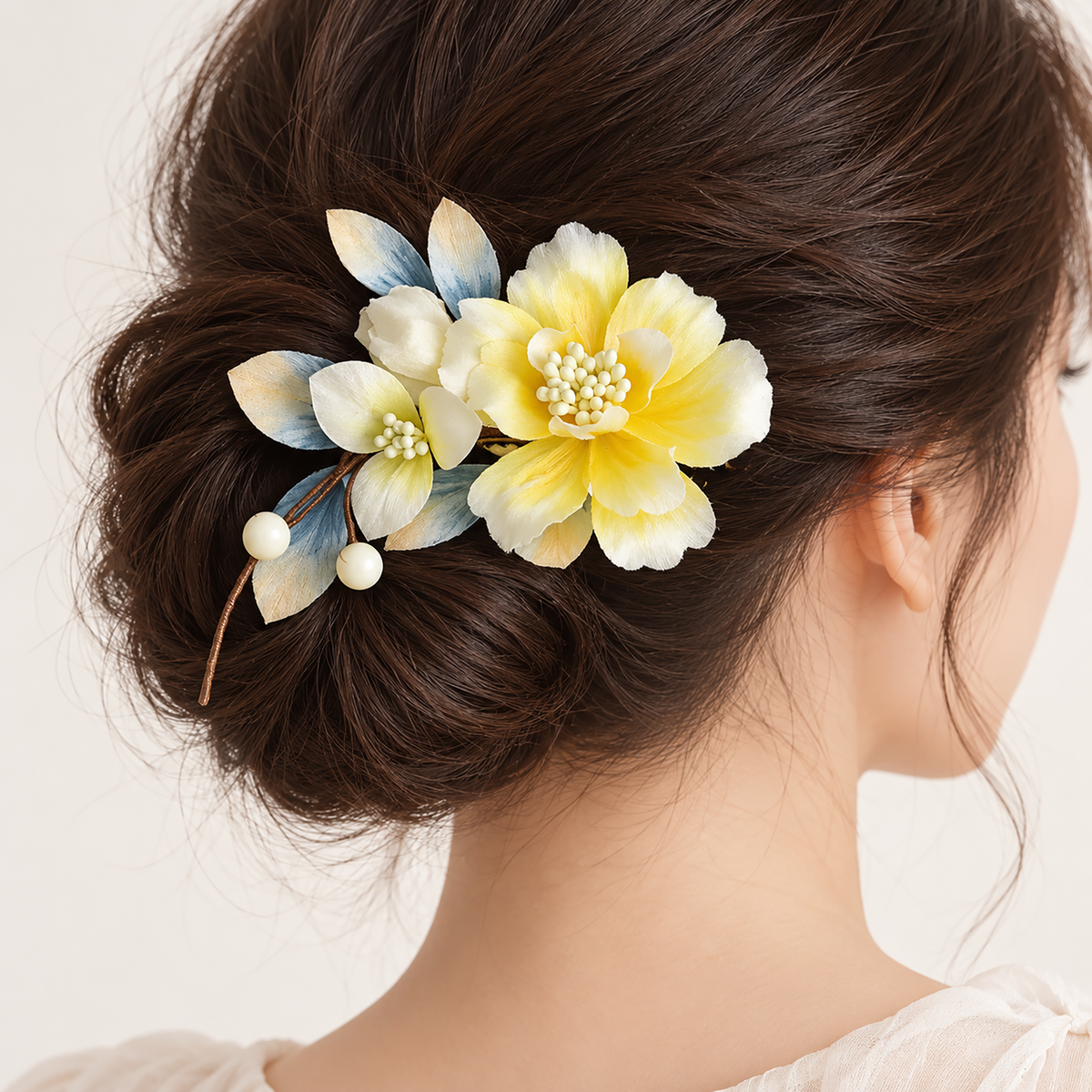Yellow blossom Ronghua hair clip worn in a low bun
