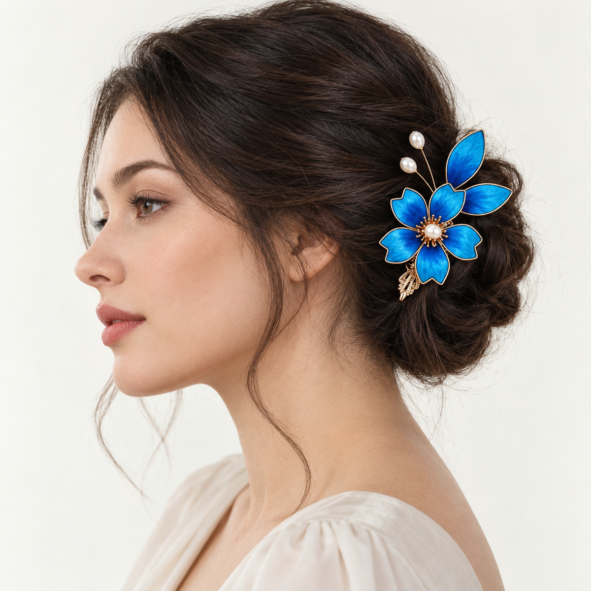 Blue begonia silk Ronghua hair clip worn in a low bun, side profile