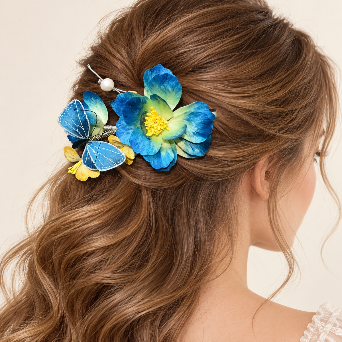 Blue blossom butterfly hair clip worn in long hair