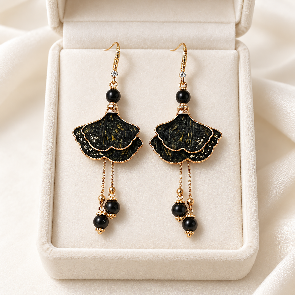 Pair of ink-dyed ginkgo mulberry-silk Ronghua drop earrings with fishhook wires, in a cream jewelry box