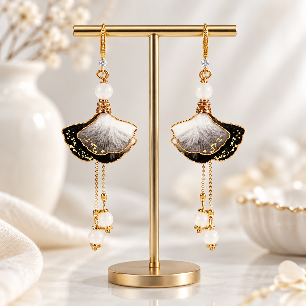 Ink-wash ginkgo silk Ronghua drop earrings on cream fabric