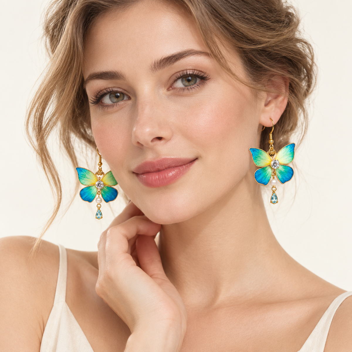 Blue-green butterfly Ronghua drop earrings worn, front view