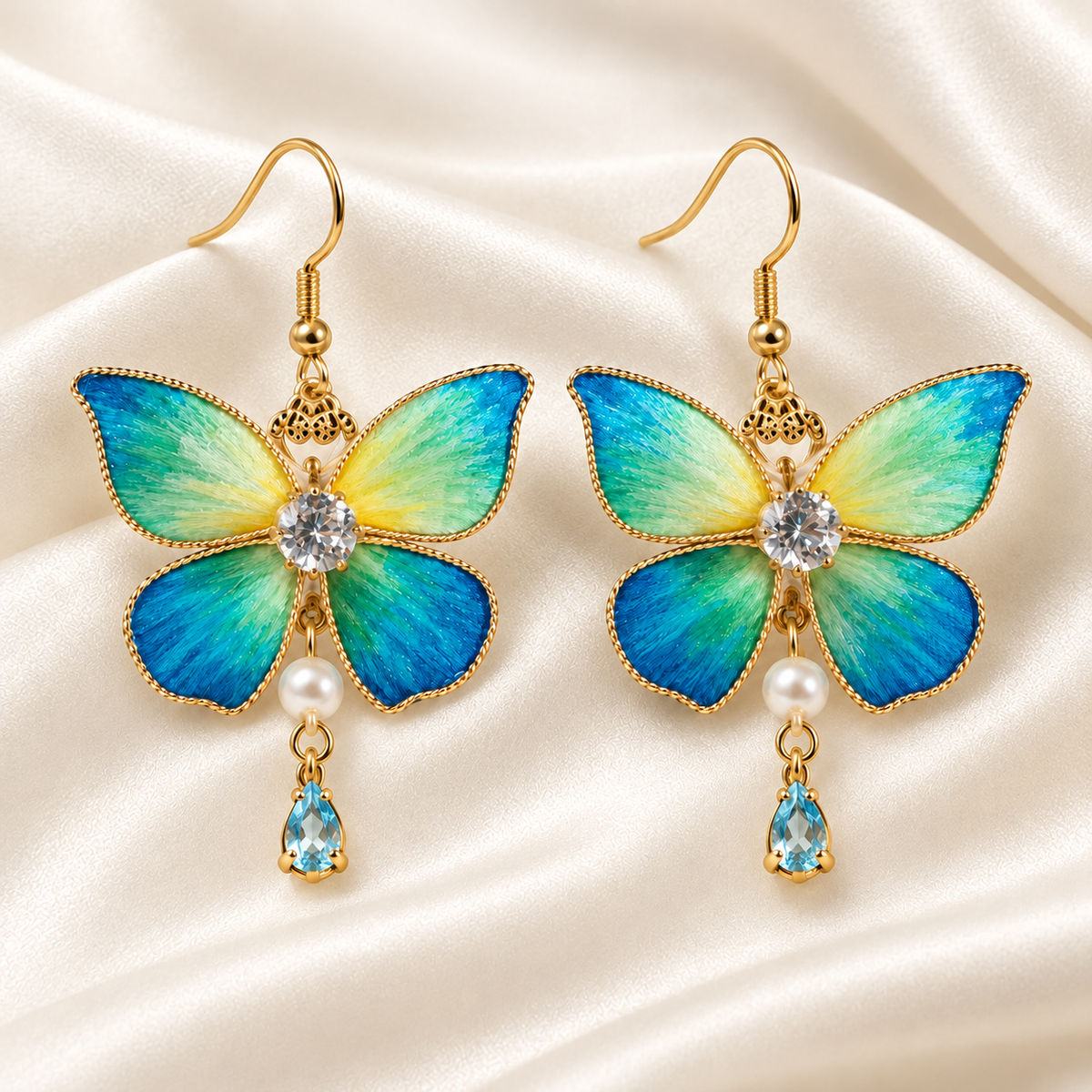 Blue-green butterfly silk Ronghua earrings on draped satin