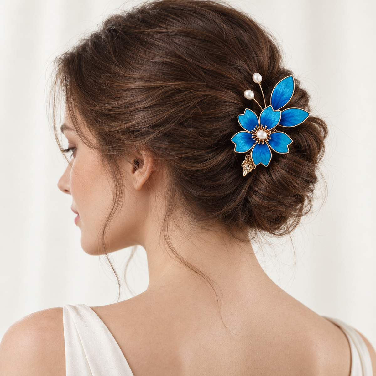 Blue Begonia Ronghua hair clip worn at the back of an updo