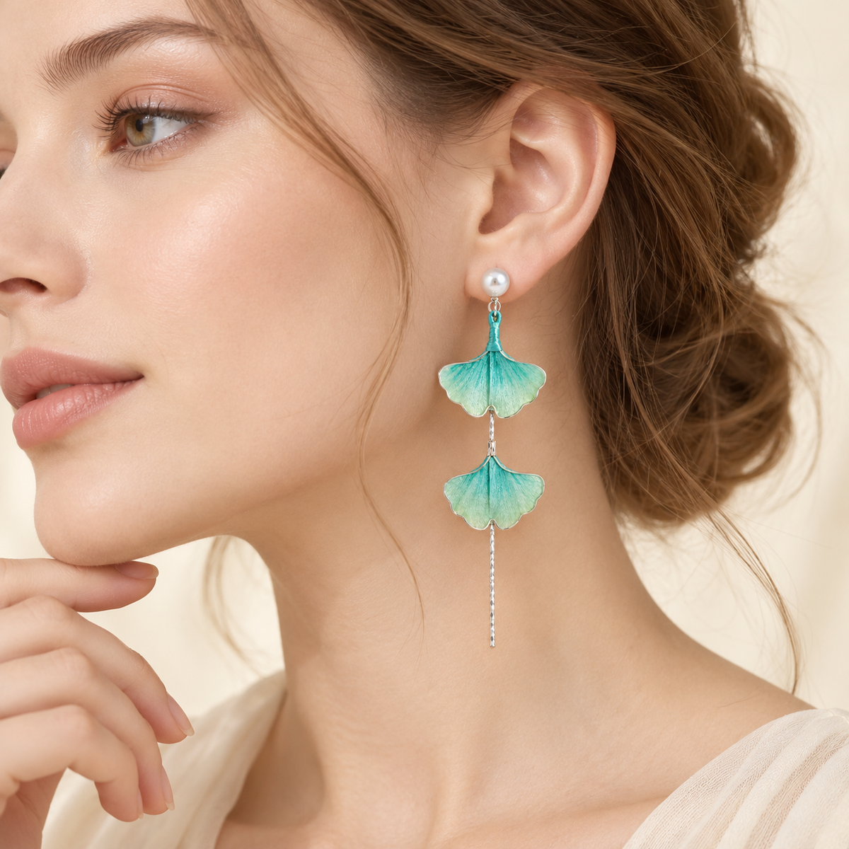 Yinxing teal ginkgo Ronghua stud earrings worn with an updo, side profile
