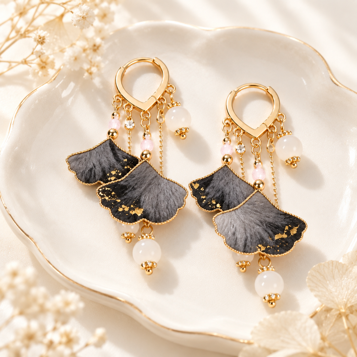 Ink-wash ginkgo Ronghua earrings showing gold-tone hinged hoops
