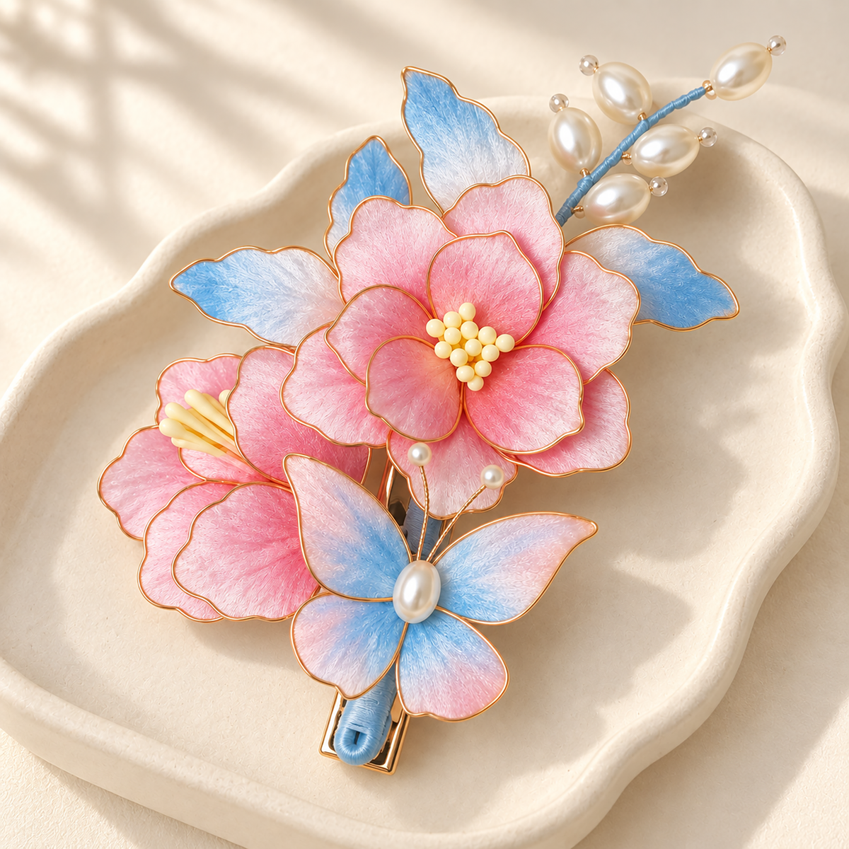 Pink peach blossom Ronghua hair clip resting on an ivory dish