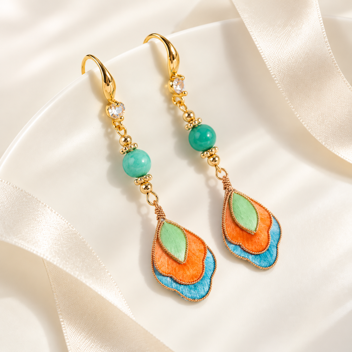 Feitian Dunhuang Ronghua drop earrings on plate with ribbon