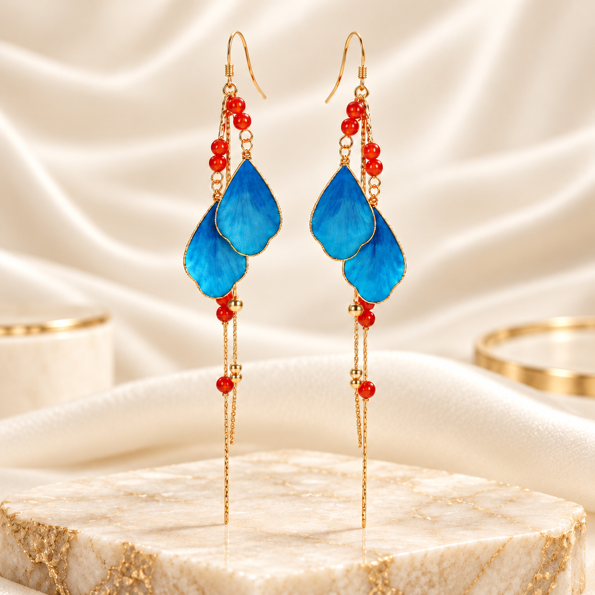 Daming Fenghua blue Ronghua earrings showing gold-tone hook ear wires