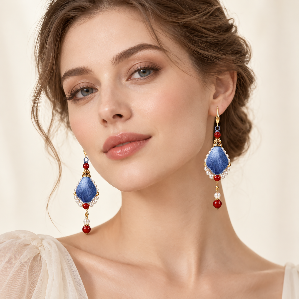 Woman wearing the blue-red silk drop earrings