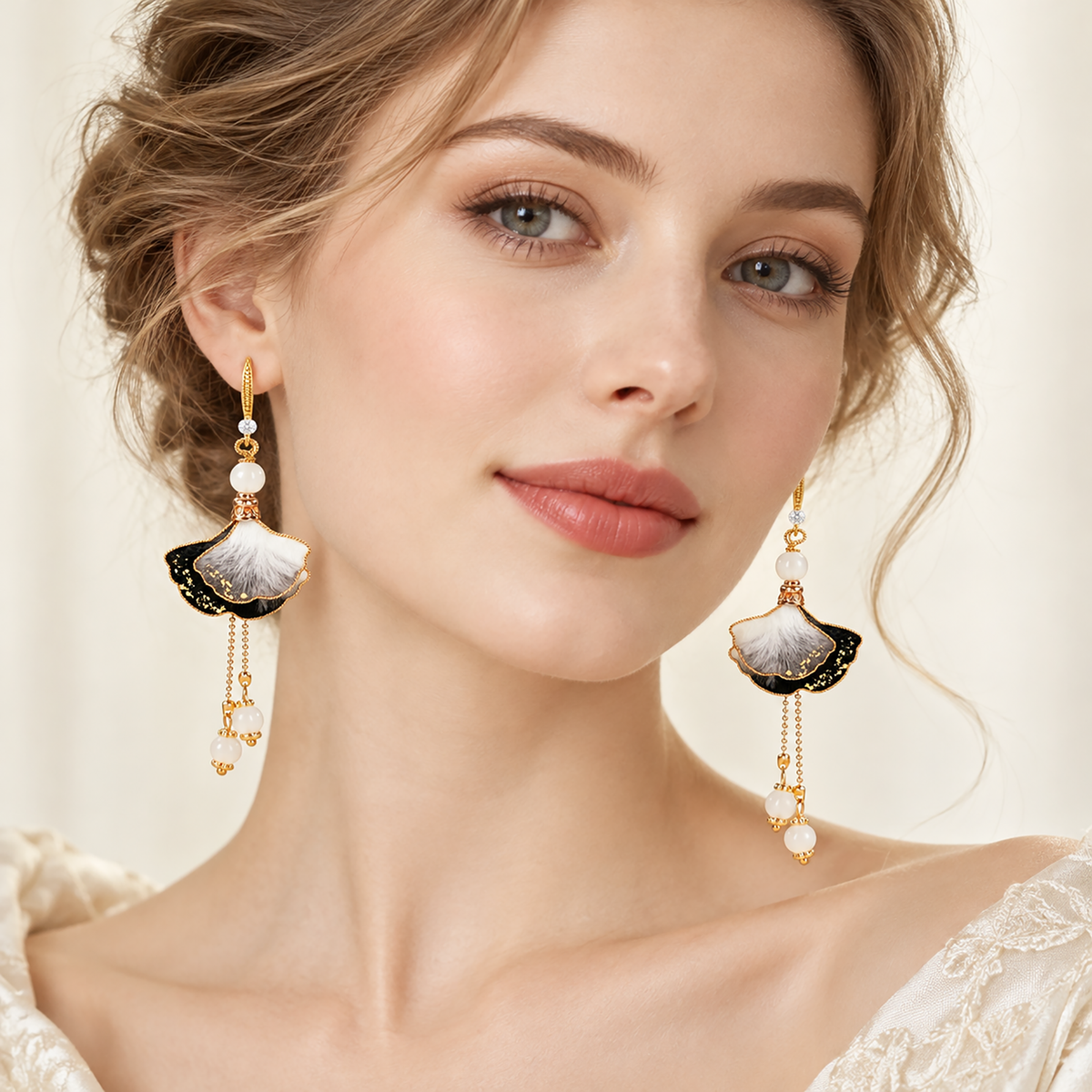 Woman wearing the ink-wash ginkgo silk Ronghua drop earrings