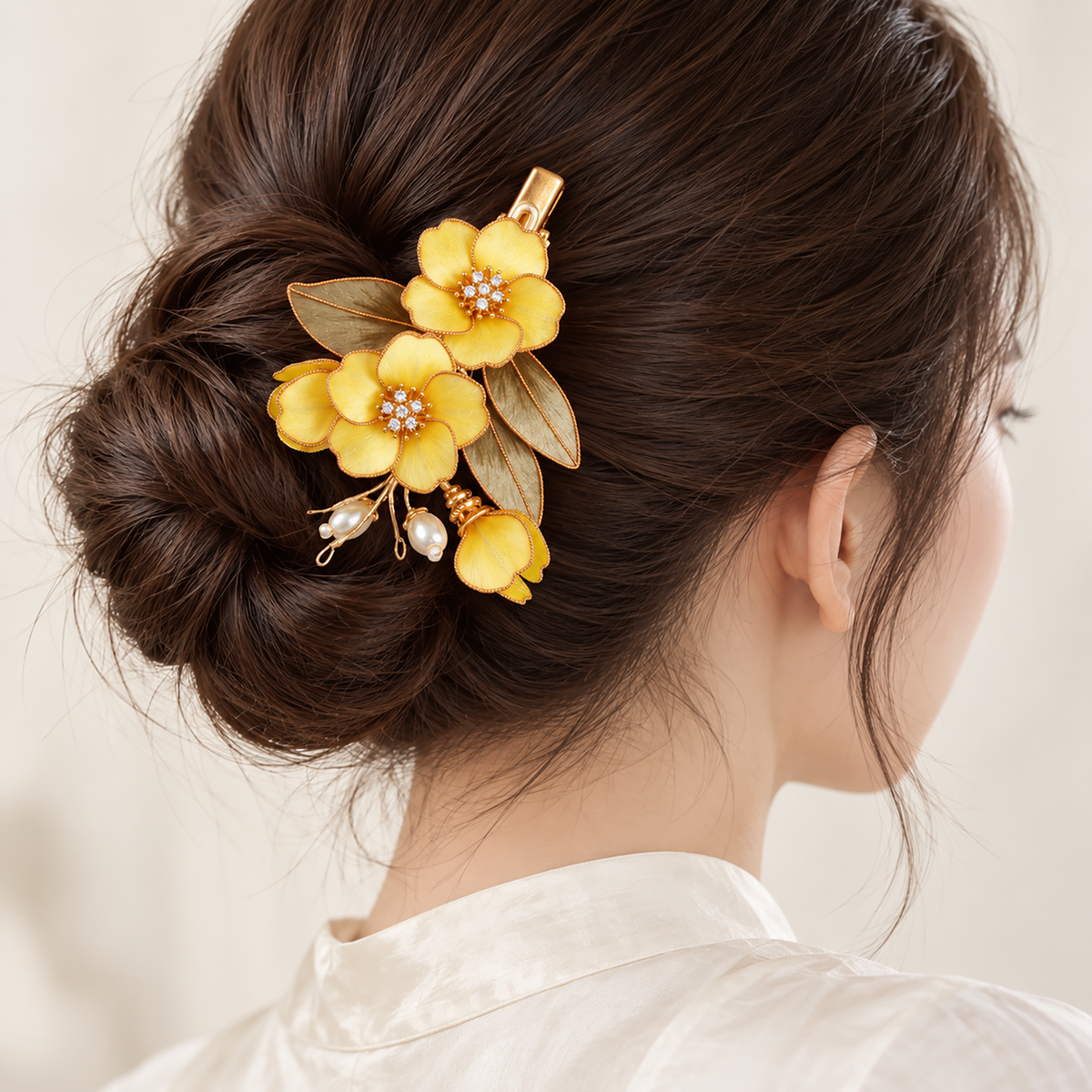 Yellow osmanthus Ronghua hair clip worn in a low bun