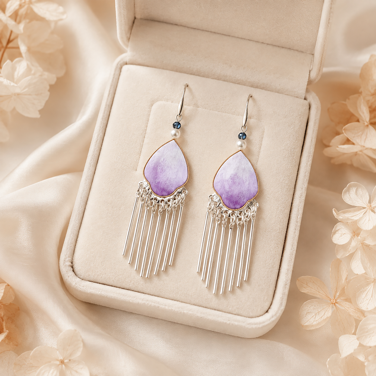 Violet Petal tassel earrings displayed in an ivory jewellery box with floral styling
