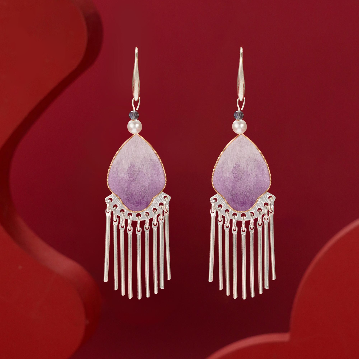Front view of violet silk velvet tassel earrings with pearl and crystal accents